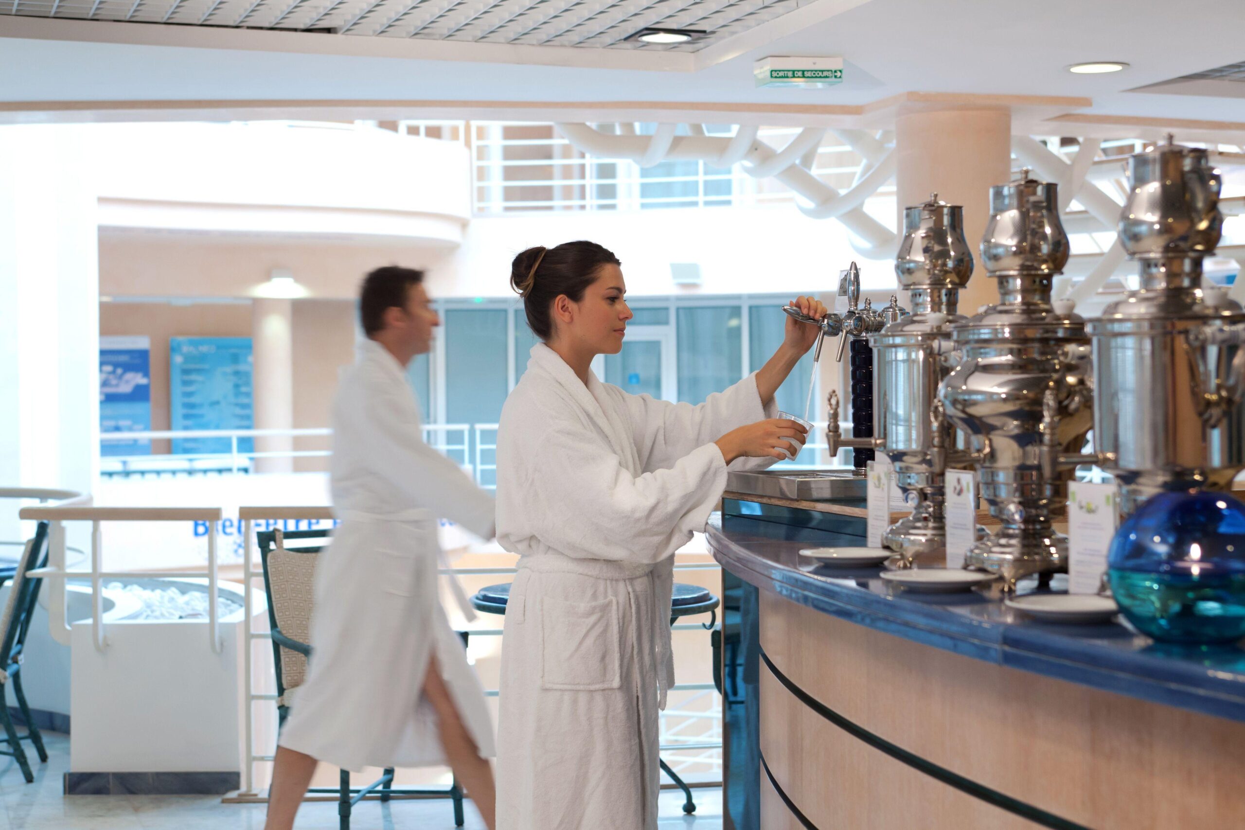 Guest participating in cure de boisson thermal mineral water routine